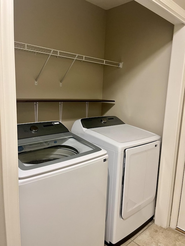 washroom with separate washer and dryer