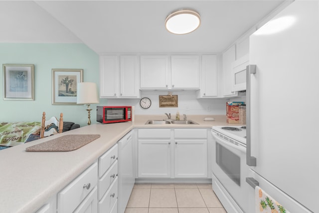 kitchen with white cabinets, sink, white appliances, and light tile patterned floors