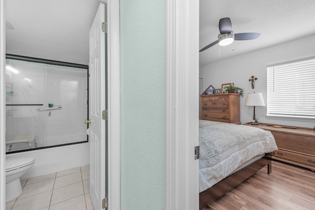 bedroom with light hardwood / wood-style flooring and ceiling fan