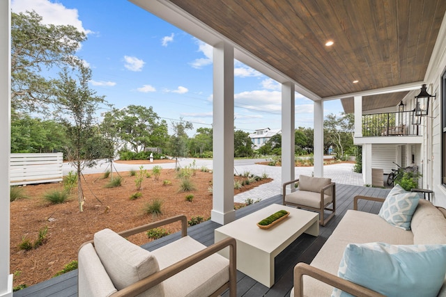 view of patio / terrace featuring an outdoor hangout area and a balcony