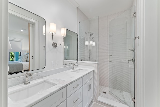 bathroom featuring vanity and a shower with shower door