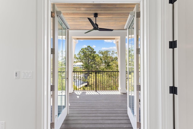 doorway to outside featuring wood ceiling, hardwood / wood-style floors, and ceiling fan