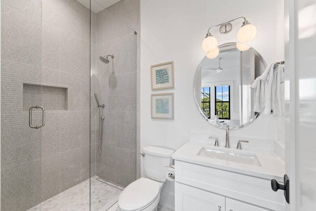 bathroom with vanity, toilet, and a shower with shower door