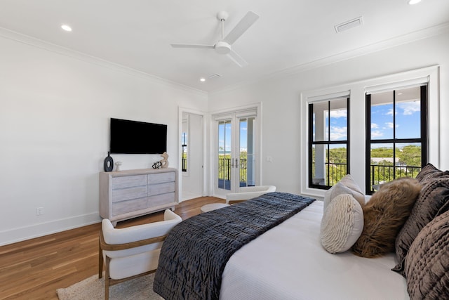 bedroom with french doors, ornamental molding, access to exterior, hardwood / wood-style flooring, and ceiling fan