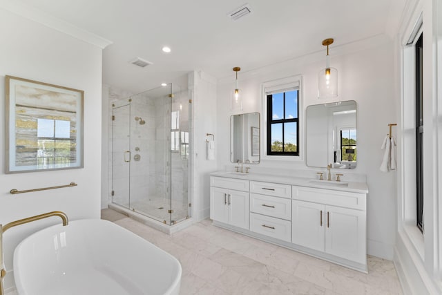 bathroom with separate shower and tub, vanity, and crown molding