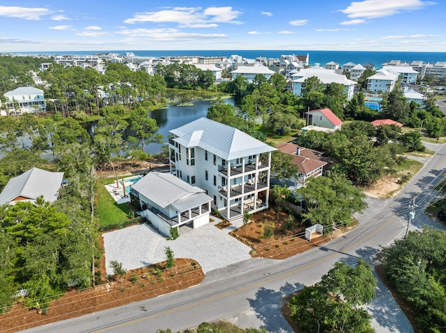 birds eye view of property with a water view