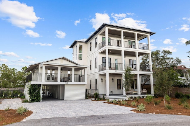 view of front of property featuring a porch and a balcony