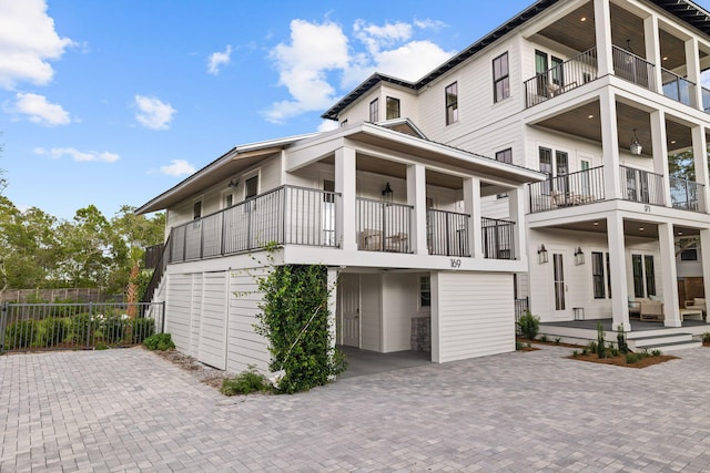 rear view of property featuring a balcony