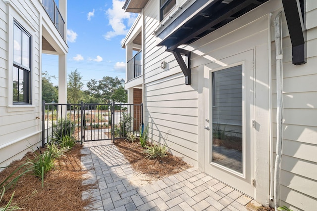 view of patio featuring a balcony