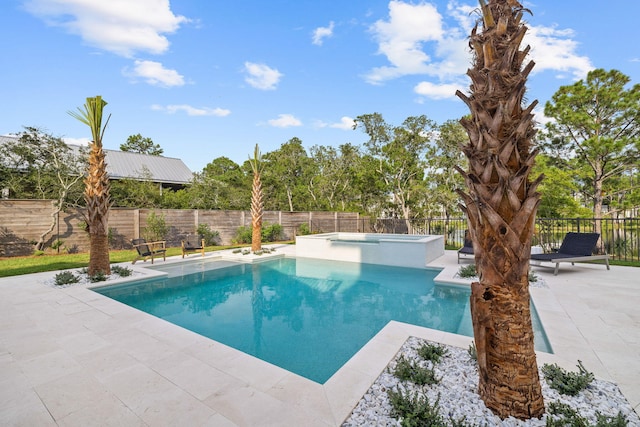 view of pool featuring an in ground hot tub and a patio area