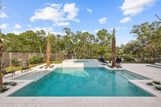 view of swimming pool featuring a patio and an in ground hot tub