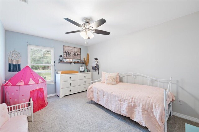 carpeted bedroom with ceiling fan