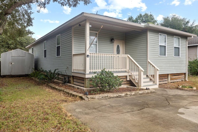 view of front facade with a storage unit