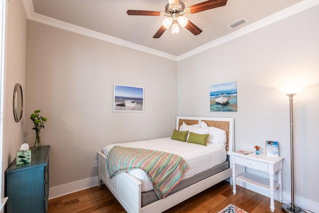 bedroom with ceiling fan, dark hardwood / wood-style flooring, and crown molding