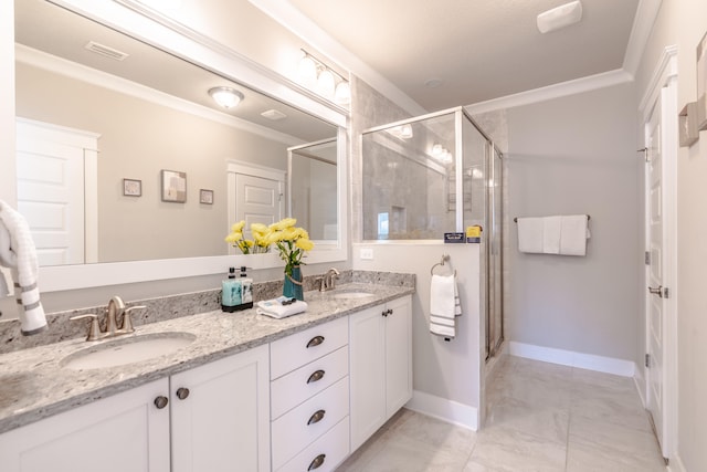 bathroom featuring vanity, a shower with door, and crown molding