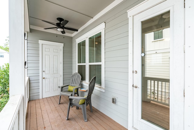 wooden deck with ceiling fan