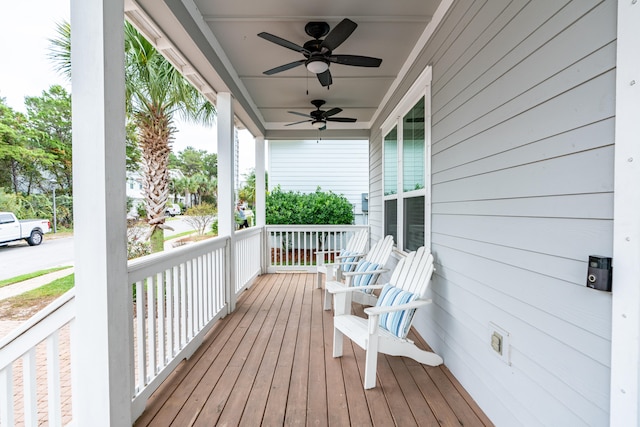 wooden deck featuring ceiling fan and a porch