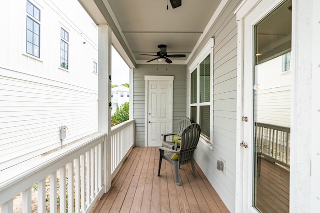 wooden terrace featuring ceiling fan