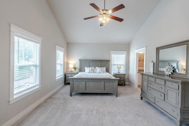 133 Grande Pointe Cir, Inlet Beach, FL 32461 - bedroom with high vaulted ceiling, multiple windows, light carpet, a ceiling fan, and connected bathroom
