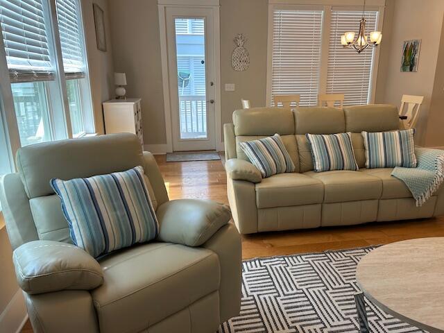 133 Grande Pointe Cir, Inlet Beach, FL 32461 - living room featuring a chandelier, healthy amount of natural light, and light wood finished floors
