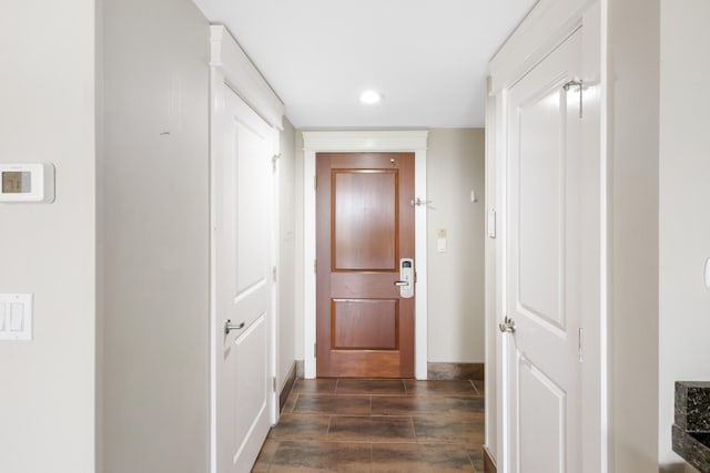 hallway featuring dark wood-type flooring