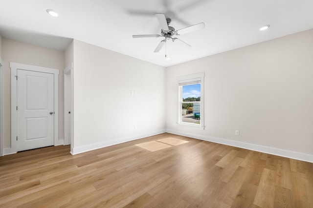 unfurnished room featuring ceiling fan and light hardwood / wood-style flooring