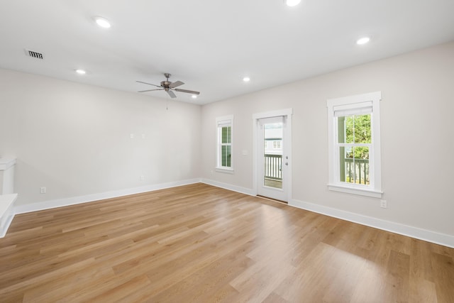 spare room with ceiling fan and light hardwood / wood-style flooring