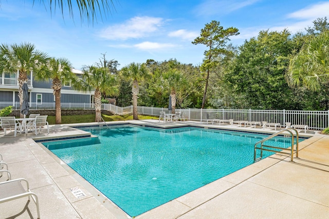 view of swimming pool with a patio area