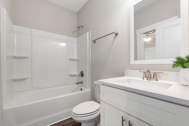 full bathroom featuring vanity, wood-type flooring, toilet, and shower / bathtub combination