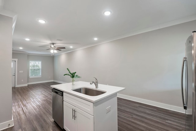 kitchen featuring stainless steel appliances, dark hardwood / wood-style flooring, sink, a kitchen island with sink, and white cabinetry