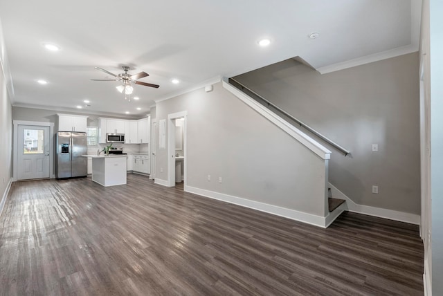 unfurnished living room featuring ceiling fan, dark hardwood / wood-style floors, and crown molding