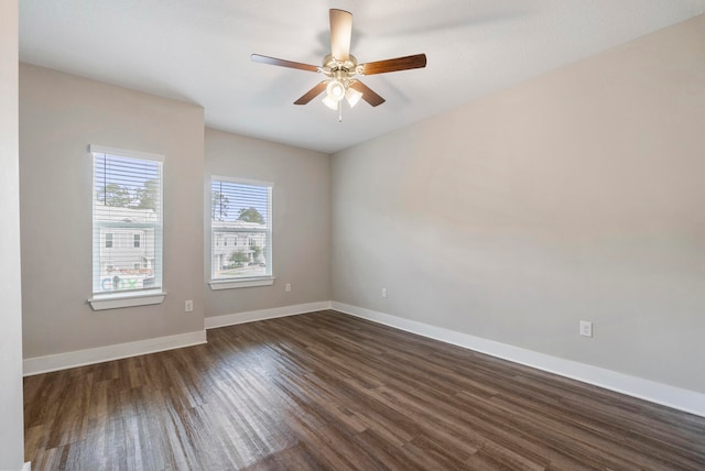 unfurnished room with dark wood-type flooring and ceiling fan