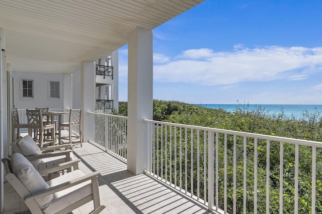 balcony featuring a water view