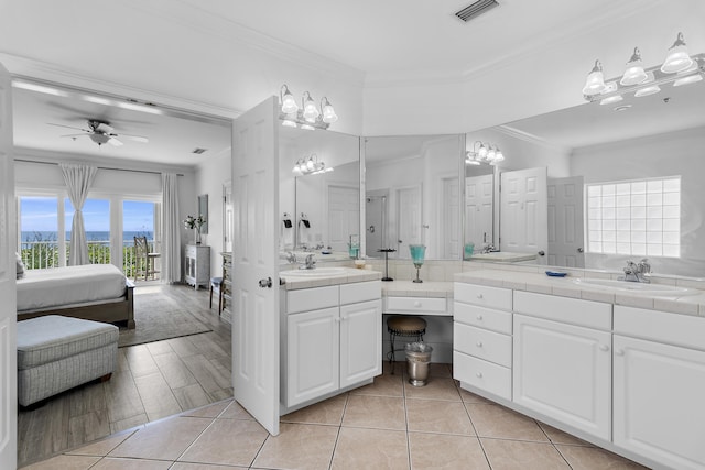 bathroom featuring hardwood / wood-style flooring, ceiling fan, vanity, and crown molding