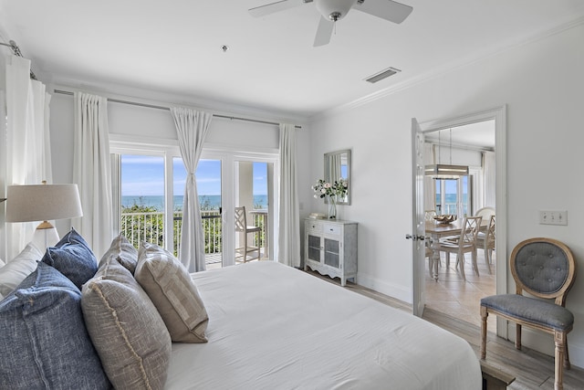 bedroom featuring ornamental molding, light hardwood / wood-style floors, ceiling fan, and access to exterior