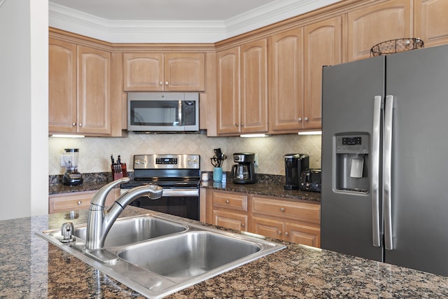 kitchen featuring crown molding, dark stone counters, stainless steel appliances, backsplash, and sink