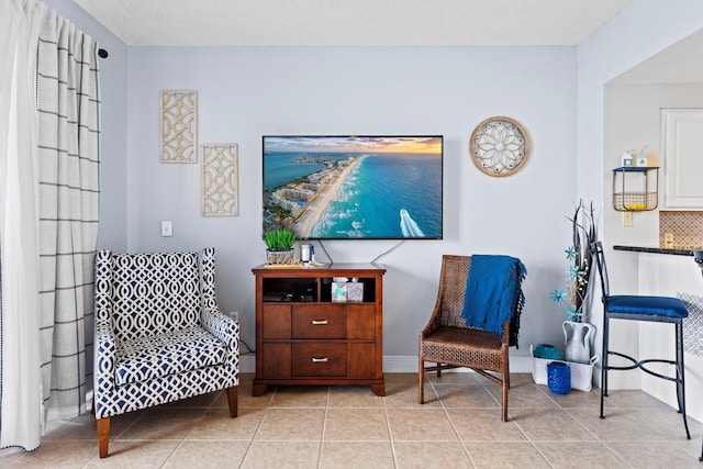 sitting room with light tile patterned flooring