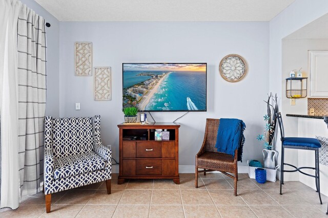 112 Seascape Dr Unit 2206, Miramar Beach, FL 32550 - sitting room featuring tile patterned floors and baseboards