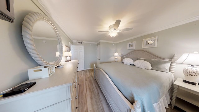 bedroom with ornamental molding, light wood-type flooring, and ceiling fan