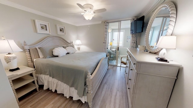 bedroom with ornamental molding, ceiling fan, and light hardwood / wood-style floors