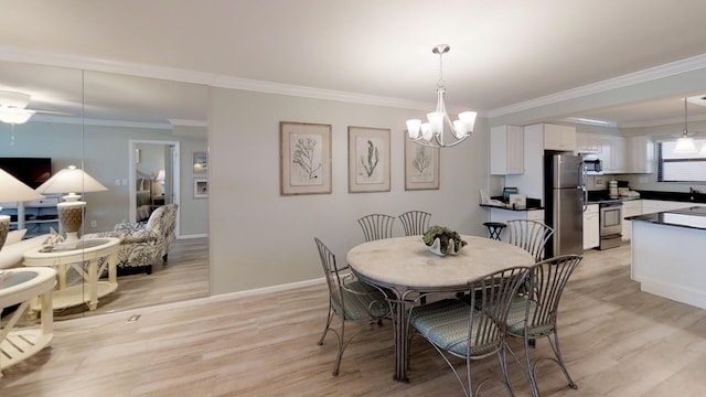 dining space with light hardwood / wood-style floors, a chandelier, and crown molding