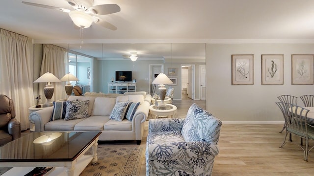 living room with ornamental molding, ceiling fan, and light hardwood / wood-style floors