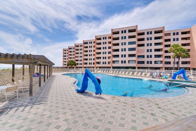 view of swimming pool featuring a pergola