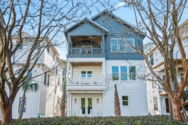 view of front of house featuring french doors and a balcony