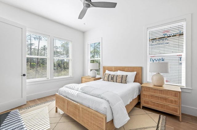 bedroom featuring light hardwood / wood-style floors and ceiling fan