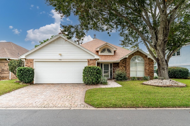 view of front facade featuring a garage and a front lawn