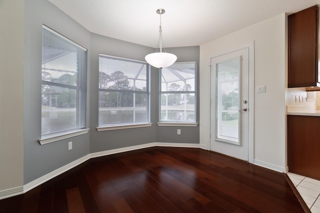 946 Shalimar Point Dr, Shalimar, FL 32579 - unfurnished dining area featuring wood-type flooring, plenty of natural light, and baseboards