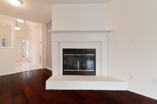 946 Shalimar Point Dr, Shalimar, FL 32579 - detailed view of a fireplace, wood finished floors, and baseboards