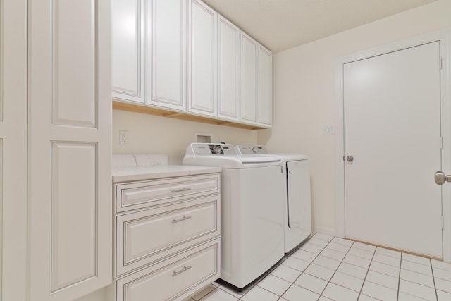 946 Shalimar Point Dr, Shalimar, FL 32579 - laundry area with cabinet space, washing machine and clothes dryer, and light tile patterned floors