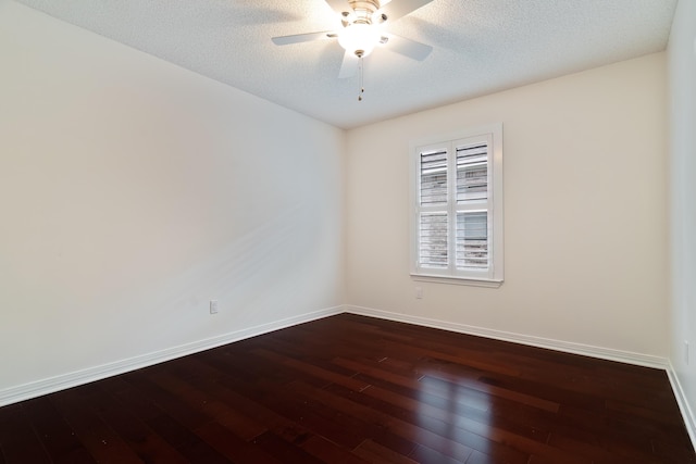 946 Shalimar Point Dr, Shalimar, FL 32579 - empty room with dark wood finished floors, baseboards, ceiling fan, and a textured ceiling